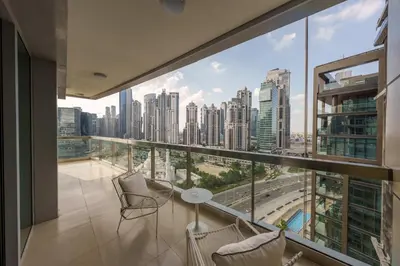 an apartment balcony with a view of the city at Discover unmatched Comfort in Downtown Dubai in Dubai