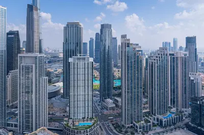 an aerial view of a large city with tall buildings at Stylish 2BR Retreat Wi-Fi & Pool Access in Dubai