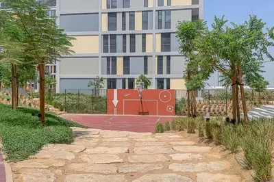 an artist rendering of a basketball court in front of a building at Frank Porter - Noor 3 Midtown in Dubai