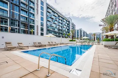an image of a swimming pool at a building at Decent 1BR at Azizi Riviera 17, Al Merkadh by Deluxe Holiday Homes in Dubai