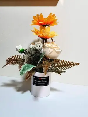 a vase with flowers in it on a table at JBR Retreat: Stylish Views in Dubai