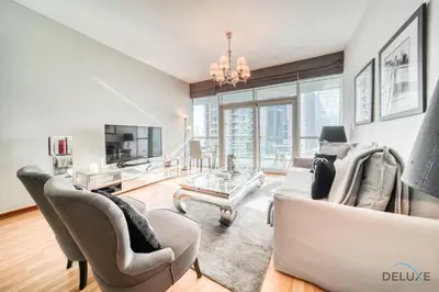a living room with a couch and chairs at Contemporary 1BR at Marina Terrace Tower Dubai Marina by Deluxe Holiday Homes in Dubai