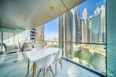 a dining room with a view of the city at Contemporary 1BR at Marina Terrace Tower Dubai Marina by Deluxe Holiday Homes in Dubai