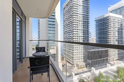 a balcony with a view of tall buildings at Silkhaus Beach Vibes with Harbor View & Private Beach in Dubai
