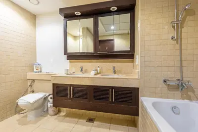 a bathroom with a sink and a toilet and a tub at Luxury 2BR Superior Apartment with Full Burj Khalifa and Dubai Mall Dancing Fountain View, Royal Tiffany in Dubai