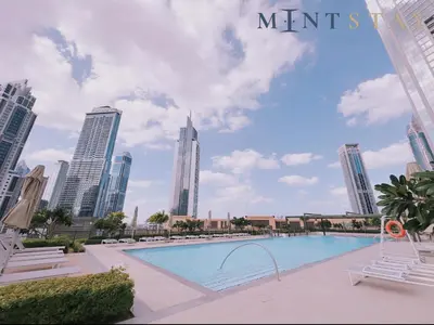 a pool in the middle of a city with tall buildings at Burj Crown , Downtown Dubai - Mint Stay in Dubai