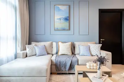 a living room with a couch and a table at Trophy - Marina Urban Serenity Suite in Dubai