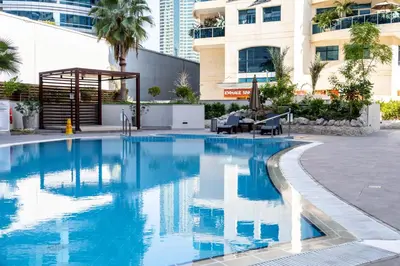 a swimming pool in the middle of a building at Trophy - Marina Urban Serenity Suite in Dubai