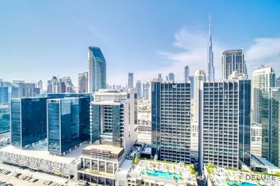 an aerial view of a city with tall buildings at Exclusive Deal, Chic 1BR at a Special Price by Deluxe Holiday Homes in Dubai