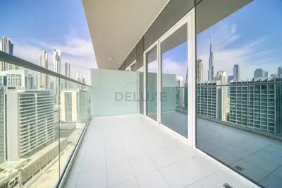 an apartment balcony with views of the city at Exclusive Deal, Chic 1BR at a Special Price by Deluxe Holiday Homes in Dubai