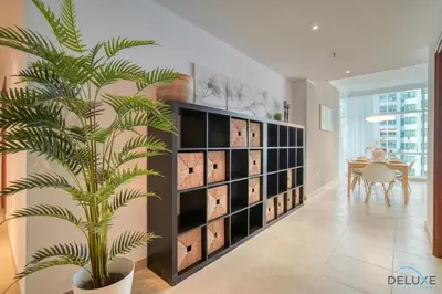 a palm tree in a room with a wine cellar at Colossal 2BR at MAG 218 Dubai Marina by Deluxe Holiday Homes in Dubai