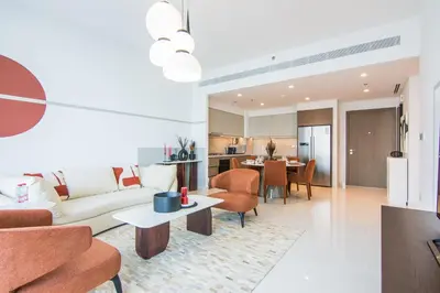 a living room with a couch and a table at Marvelous Apartment in Beachfront Private Beach in Dubai