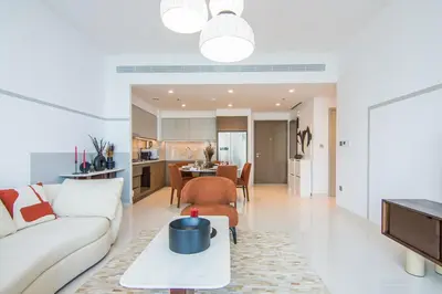 a living room with a couch and a table at Marvelous Apartment in Beachfront Private Beach in Dubai