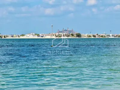 a sign in the middle of a large body of water at Pleasant 1BD apartment with the beach access in Dubai