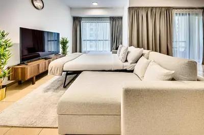 a living room with two beds and a couch at Delightful 2BD apartment near the JBR in Dubai