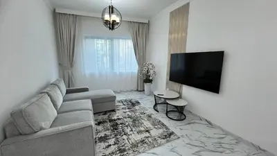 a living room with a couch and a flat screen tv at Stay in heart of Dubai Marina walk to JBR beach 8 in Dubai