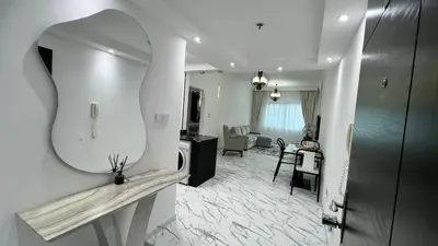 a bathroom with a mirror and a living room at Stay in heart of Dubai Marina walk to JBR beach 8 in Dubai