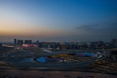 a large highway with a city in the background at Studion In Dubailand - Close Kitchen in Dubai