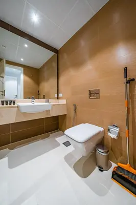 a bathroom with a toilet and a sink at SettlerHomes - Sparkle Tower 2 with Stunning Views in Dubai