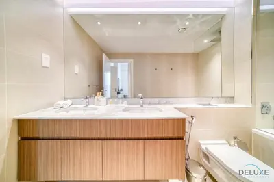 a bathroom with a sink and a mirror at Magnificent 2BR at La Voile Jumeirah by Deluxe Holiday Homes in Dubai