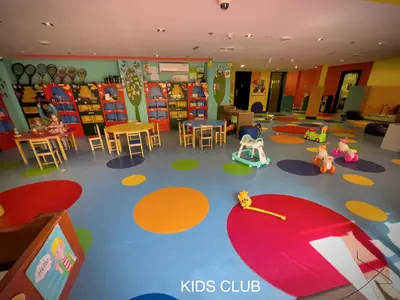 a room with a classroom with toys and tables and chairs at Elegant 1BR Full Palm View Apartment at 5 Star Resort in Dubai