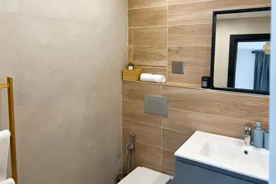 a bathroom with a sink and a mirror at FavDubai presents 2BR apartment in The Heart of JBR and Dubai Marina 150 m to JBR Beach with famous Ain Dubai view the biggest ferris wheel in the world Swimming pool access, air-conditioned gym, free parking & Housekeeping in Dubai