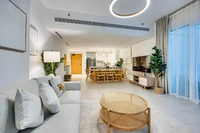 a living room with a couch and a table at Panoramic sea view from new 2BD in La Vie JBR in Dubai