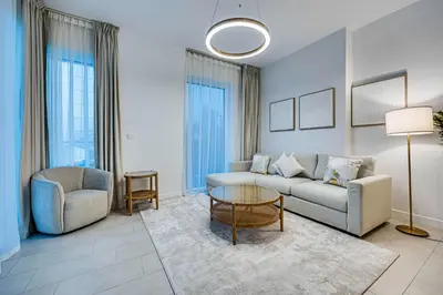 a living room with a couch and a table at Panoramic sea view from new 2BD in La Vie JBR in Dubai