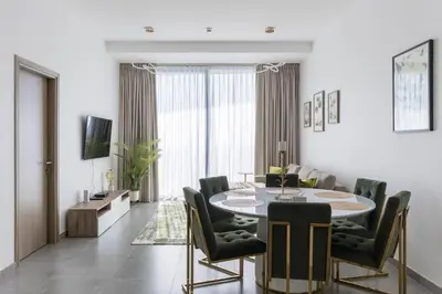 a dining room with a table and chairs at Stella Maris High Floor,Stunning Skyline Views in Dubai
