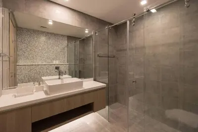a bathroom with a sink and a glass shower at Stella Maris High Floor,Stunning Skyline Views in Dubai
