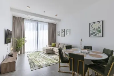 a living room with a table and a couch at Stella Maris High Floor,Stunning Skyline Views in Dubai