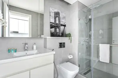 a bathroom with a sink and a toilet and a shower at Frank Porter - Ahad Residences in Dubai