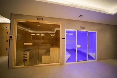 a room with a glass door with a balcony at Modern Studio, Canal View, Elite Downtown, Dubai - 13AB06 in Dubai