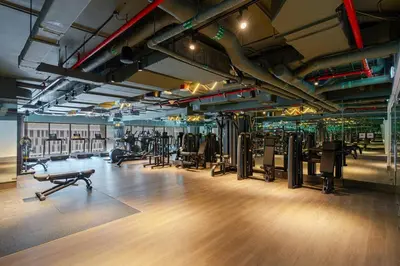 a gym with a lot of treadmills and exercise equipment at Luxurious Flat 3 Min to Burj Khalifa Sleeps 3 in Dubai