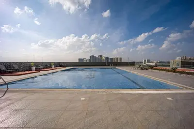 a large swimming pool on the roof of a building at Amazing Luxury Studio in Dubai in Dubai