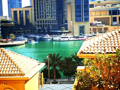 a view of a river with boats in a city at Spacious 2BR Apt on JBR Beach near Mall & Metro By La Buena Vida Holiday Homes in Dubai