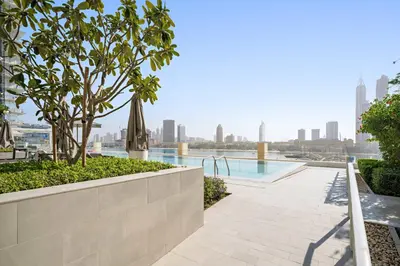 a swimming pool with a view of the city at Silkhaus Sea View 1BDR in Marina Vista, near Marina in Dubai