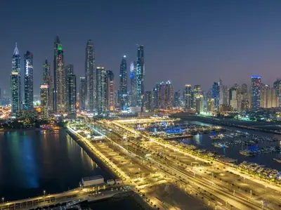 a large city at night with a lot of traffic at FIRST CLASS 3BR with Dubai Marina & Palm View in Dubai