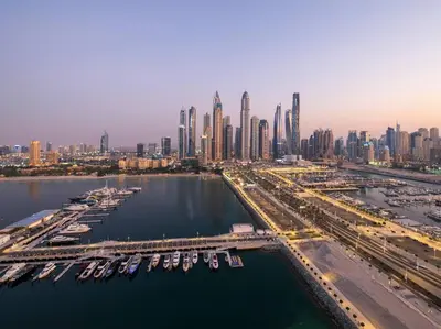 an aerial view of a city with a harbor with boats at FIRST CLASS 3BR with Dubai Marina & Palm View in Dubai
