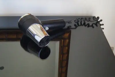 a hair dryer is attached to a door at Seaview & Marina View Studio in Dubai