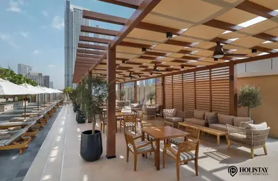 a patio with tables and chairs on a building at Kempinski Central Avenue Residence - Direct Access Dubai Mall in Dubai