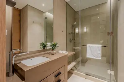 a bathroom with a sink and a shower at GuestReady - Sky-High Dubai Dreamscape in Dubai