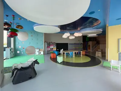 a living room with a table and a ceiling at GuestReady - Sky-High Dubai Dreamscape in Dubai