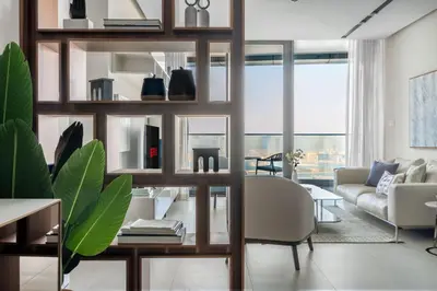 a living room with a couch and a table at GuestReady - Sky-High Dubai Dreamscape in Dubai