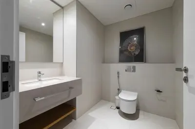 a white bathroom with a sink and a toilet at LUXSeaside/2BD/LaVie/JBR in Dubai