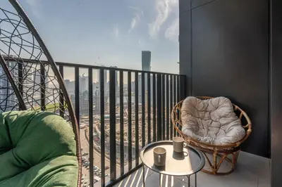 a balcony with a chair and a table with a view at GuestReady - A fantastic home in Business Bay in Dubai