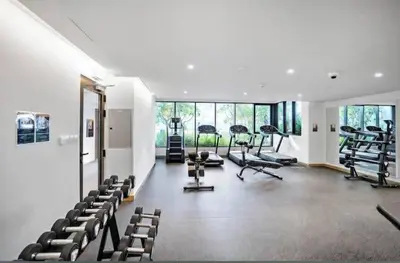 a gym with treadmills and exercise equipment in a room at GuestReady - A fantastic home in Business Bay in Dubai