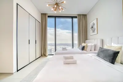a bedroom with two beds and a large window at Address JBR Marina View, JBR, Dubai Marina - Mint Stay in Dubai