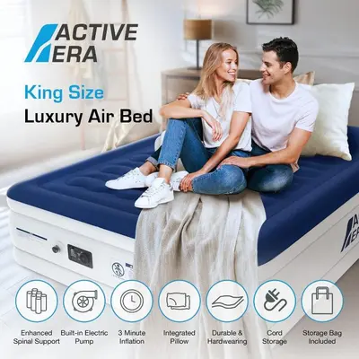 a man and a woman sitting on a king size luxury air bed at 35% OFF in Top View Studio w/ Balcony in Marina in Dubai