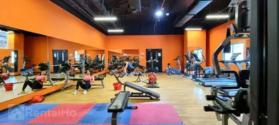 a gym with people exercising on tread machines at 35% OFF in Top View Studio w/ Balcony in Marina in Dubai